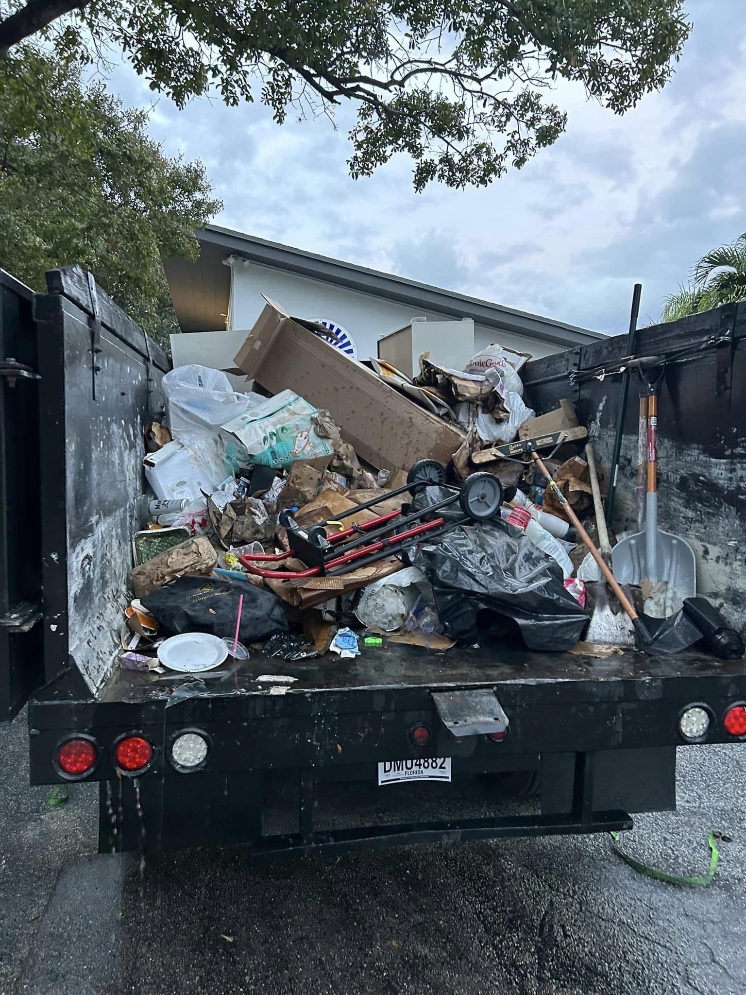 Full Dump truck load for Junk removal job in Broward County Florida.